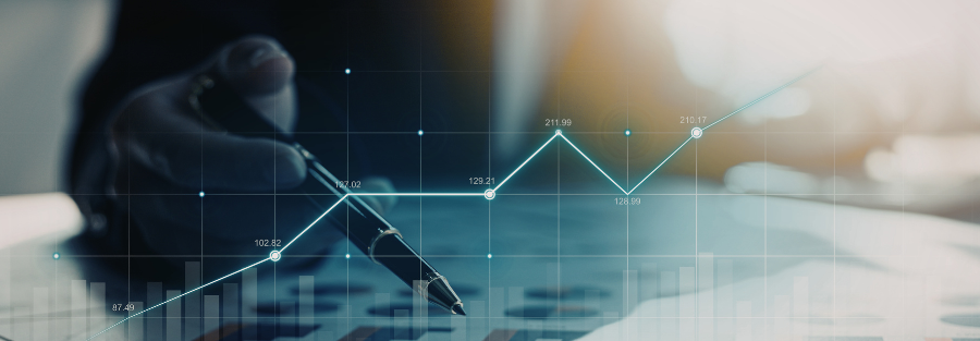 Close-up of a hand holding a pen over financial charts with a rising line graph, illustrating business growth, data analysis, and financial performance.